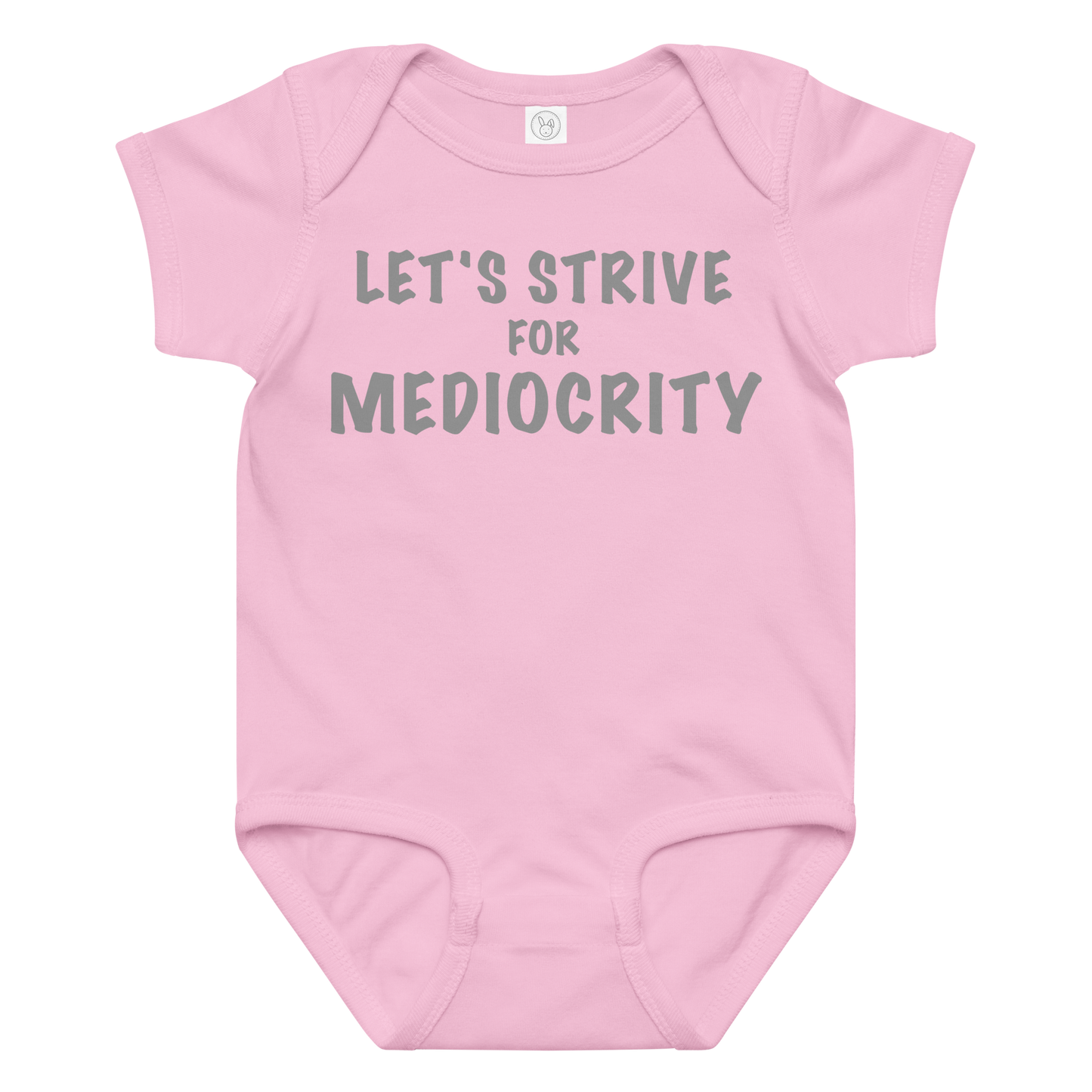 "Let's strive for mediocity" printed on a pink baby jersey bodysuit laying on a flat surface amongst other clothes