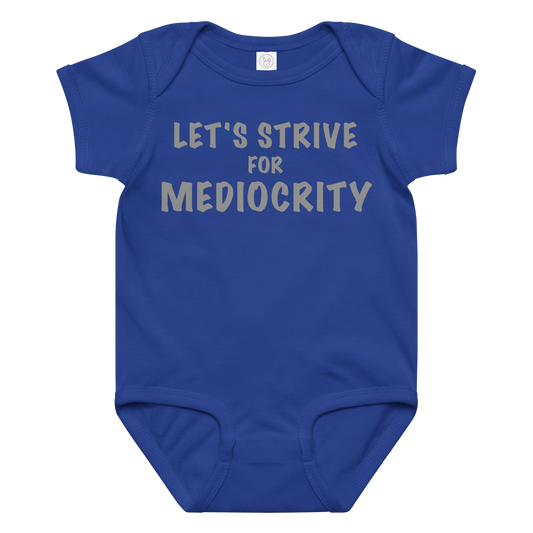 "Let's strive for mediocity" printed on a royal baby jersey bodysuit laying on a flat surface amongst other clothes
