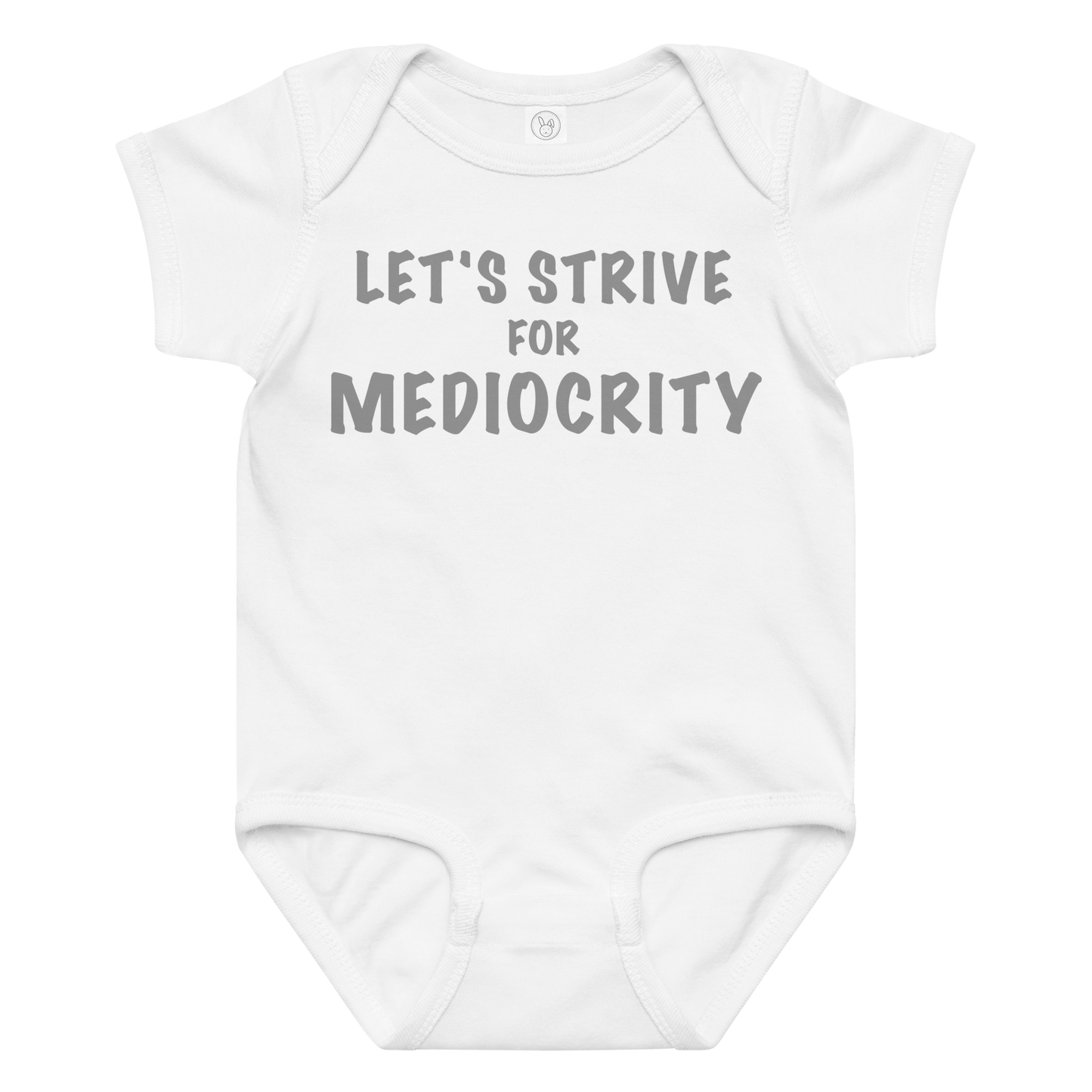 "Let's strive for mediocity" printed on a white baby jersey bodysuit laying on a flat surface amongst other clothes