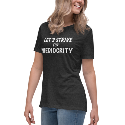 "Let's strive for mediocity" printed on a dark grey heather women's relaxed t-shirt worn by a female