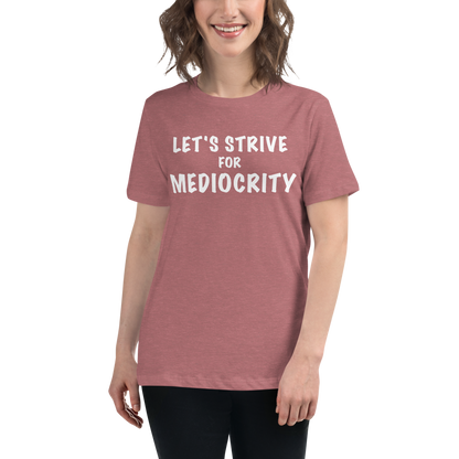 "Let's strive for mediocity" printed on a heather mauve women's relaxed t-shirt worn by a female