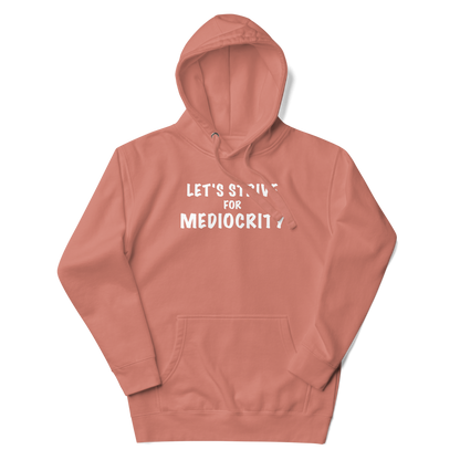 "Let's strive for mediocity" printed on a dusty rose unisex hoodie laying on a flat surface with the hood up