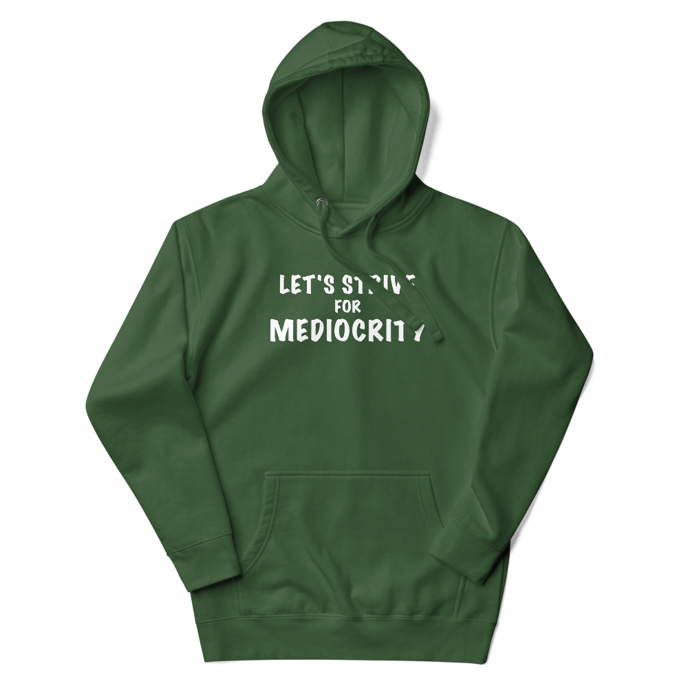 "Let's strive for mediocity" printed on a forest green unisex hoodie laying on a flat surface with the hood up