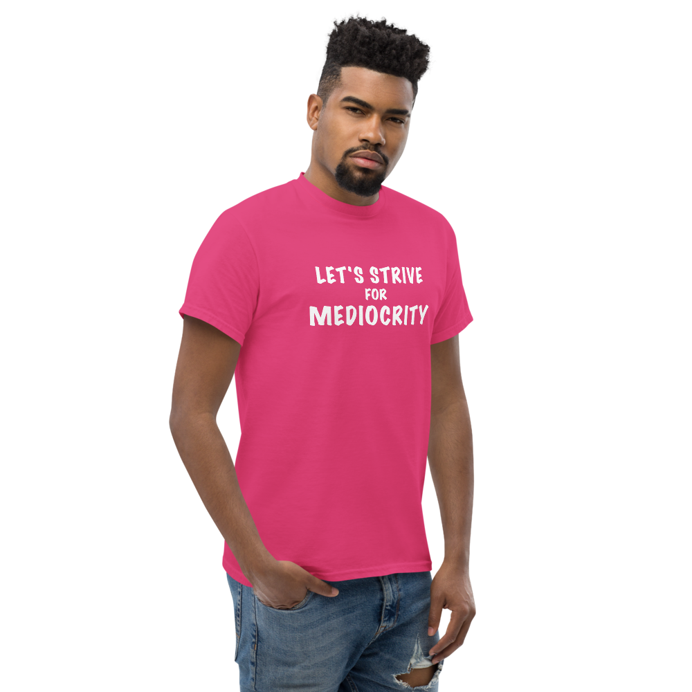 "Let's strive for mediocity" printed on a heliconia unisex classic tee worn by a male