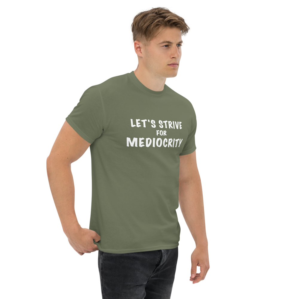 "Let's strive for mediocity" printed on a military green unisex classic tee worn by a male