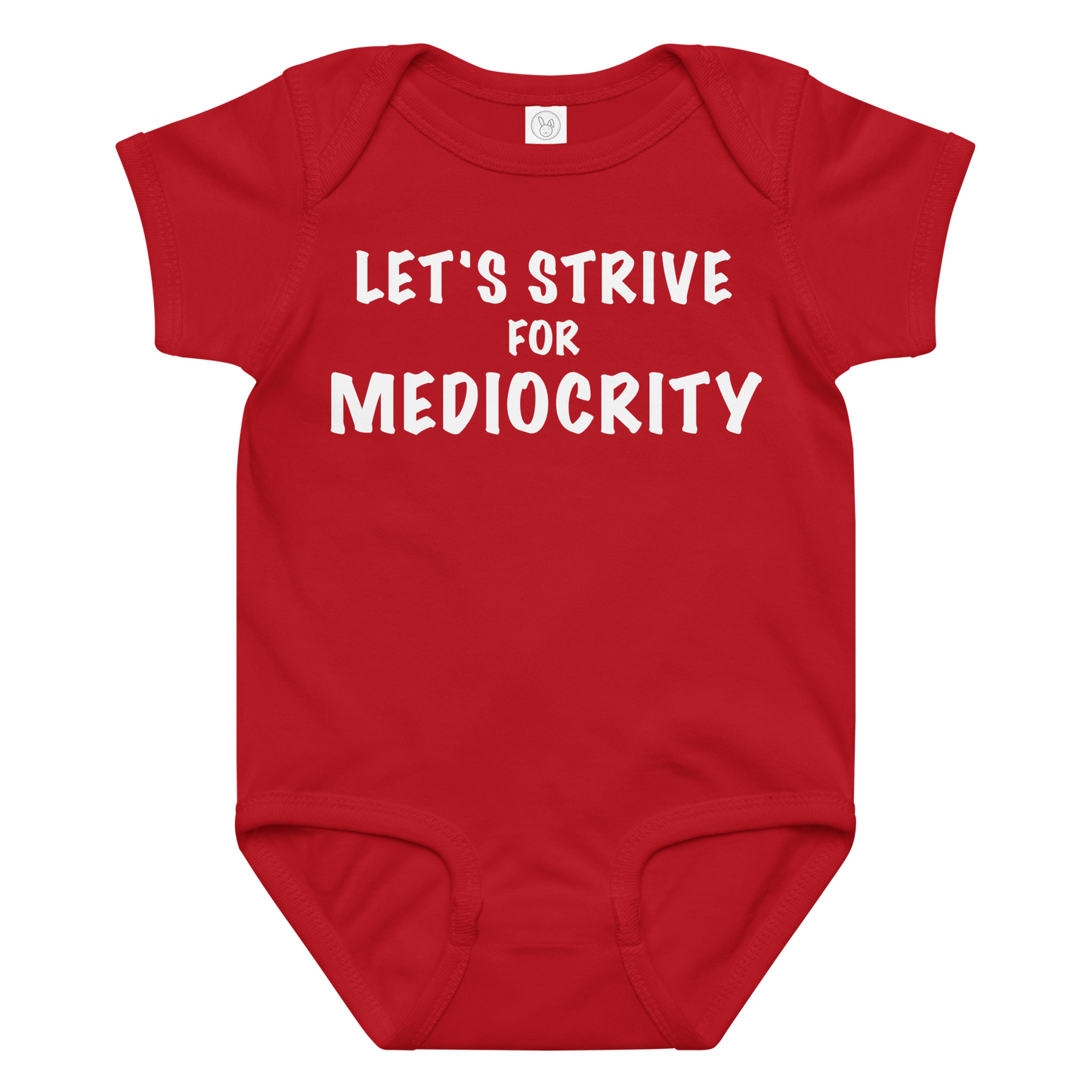 "Let's strive for mediocity" printed on a red baby jersey bodysuit laying on a flat surface amongst other clothes