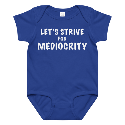 "Let's strive for mediocity" printed on a royal baby jersey bodysuit laying on a flat surface amongst other clothes
