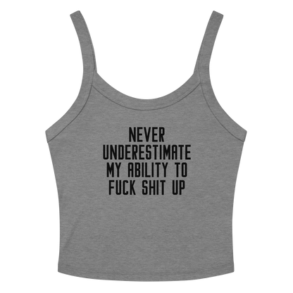 "Never Understimate My Ability To Fuck Shit Up" printed on a athletic heather women's micro-rib tanktop laying on a flat surface amongst sunglasses and shorts