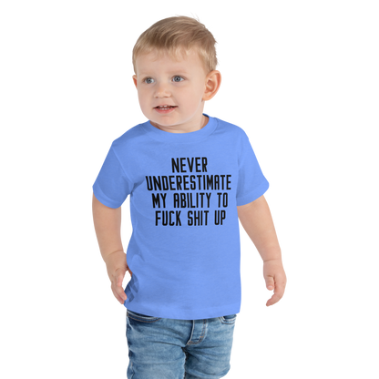"Never Understimate My Ability To Fuck Shit Up" printed on a heather columbia blue toddler short sleeve tee worn by a male