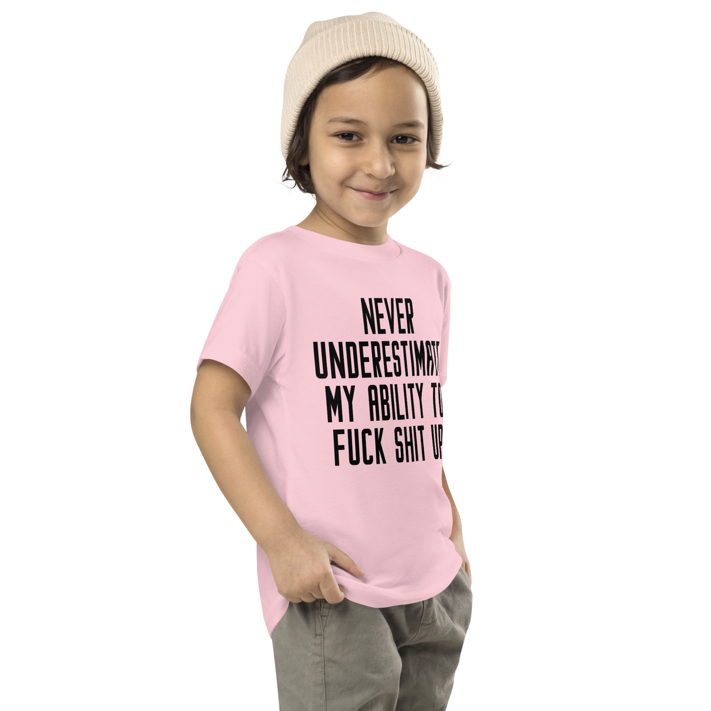 "Never Understimate My Ability To Fuck Shit Up" printed on a pink toddler short sleeve tee worn by a male who is also wearing a knit cap