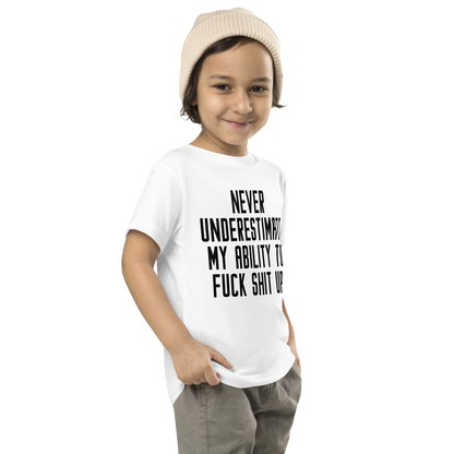 "Never Understimate My Ability To Fuck Shit Up" printed on a white toddler short sleeve tee worn by a male who is also wearing a knit cap