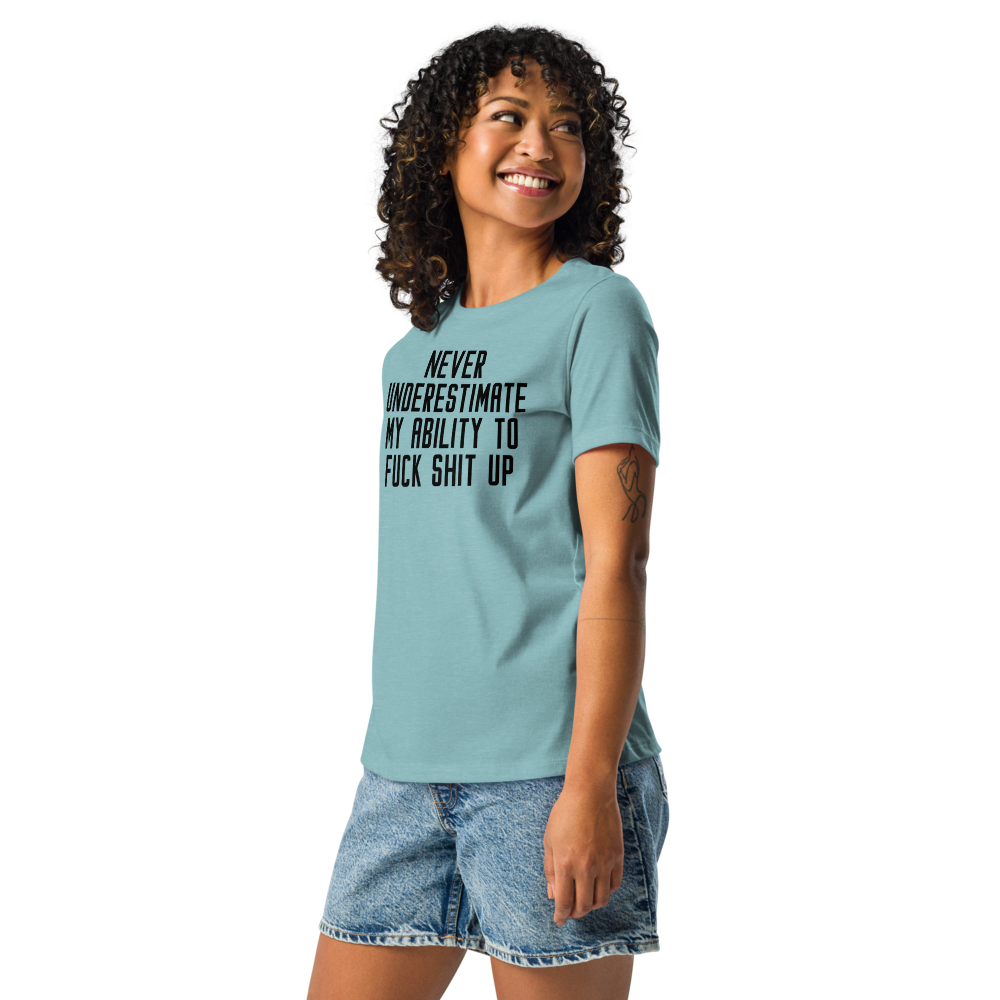 "Never Understimate My Ability To Fuck Shit Up" printed on a heather blue lagoon women's relaxed t-shirt worn by a female