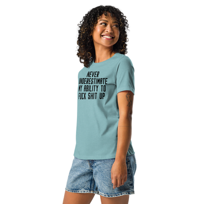 "Never Understimate My Ability To Fuck Shit Up" printed on a heather blue lagoon women's relaxed t-shirt worn by a female