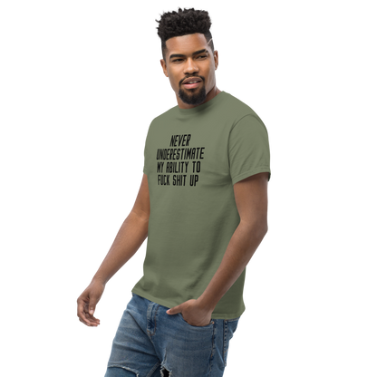 "Never Understimate My Ability To Fuck Shit Up" printed on a military green unisex classic tee worn by a male