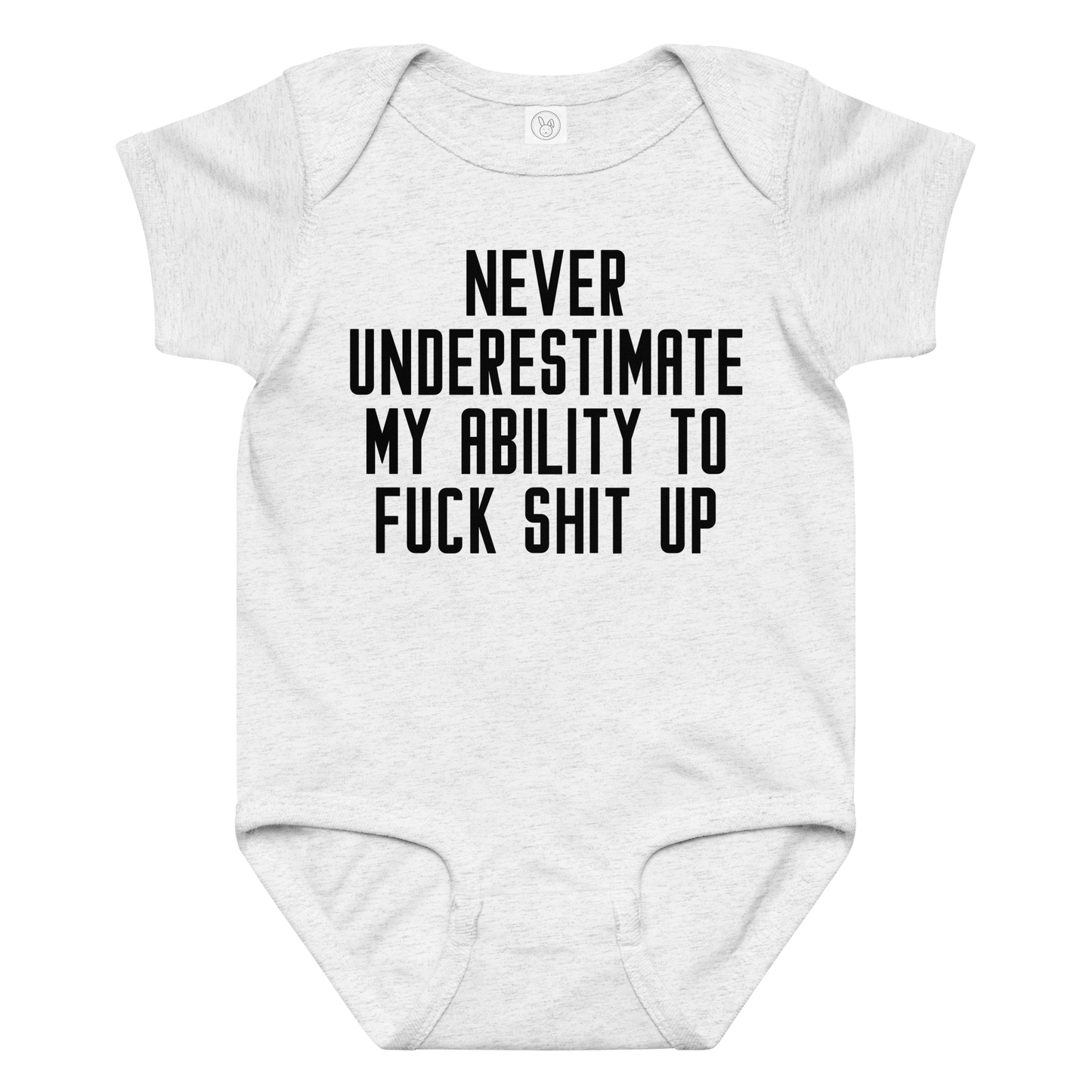 "Never Understimate My Ability To Fuck Shit Up" printed on a ash baby jersey bodysuit laying on a flat surface amongst other clothes