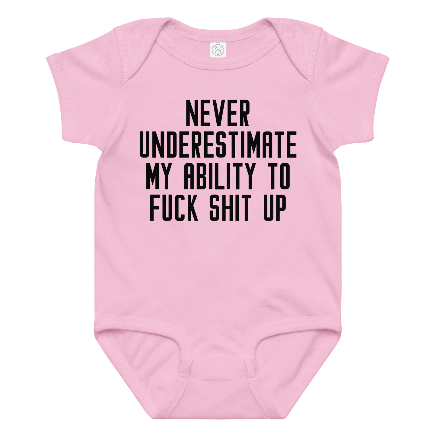"Never Understimate My Ability To Fuck Shit Up" printed on a pink baby jersey bodysuit laying on a flat surface amongst other clothes