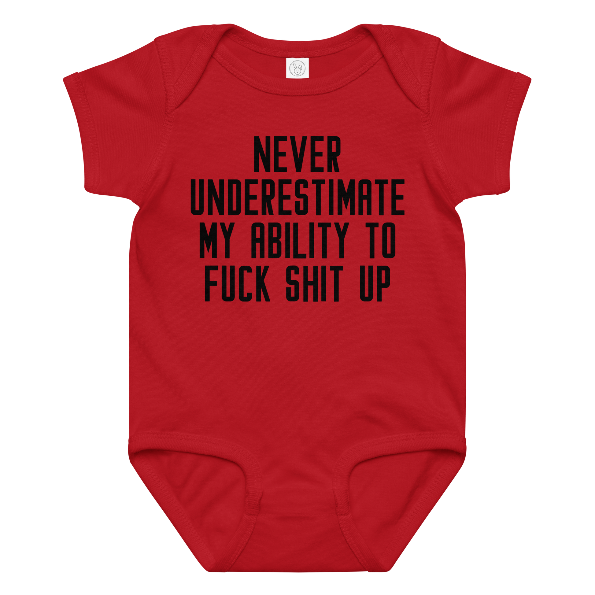"Never Understimate My Ability To Fuck Shit Up" printed on a red baby jersey bodysuit laying on a flat surface amongst other clothes