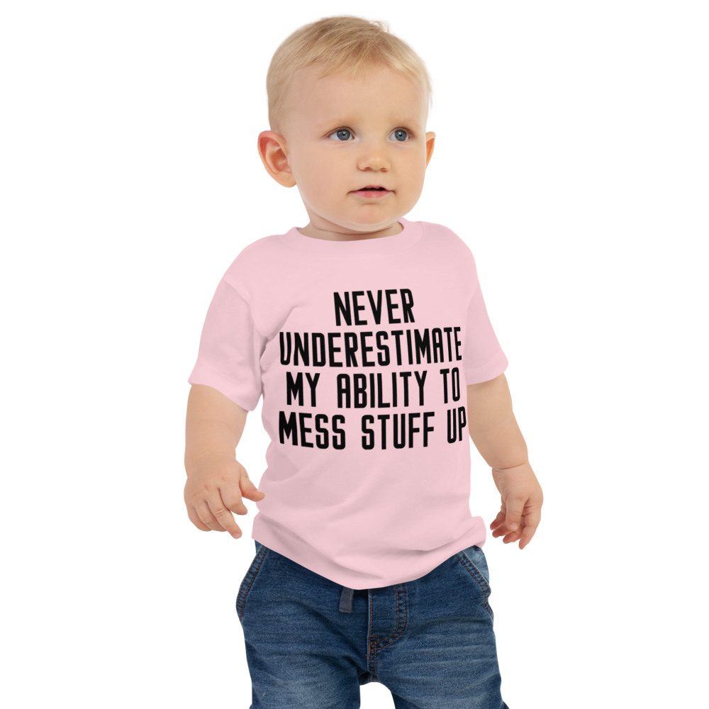 "Never Understimate My Ability To Mess Stuff Up" printed on a pink baby jersey short sleeve tee worn by a male