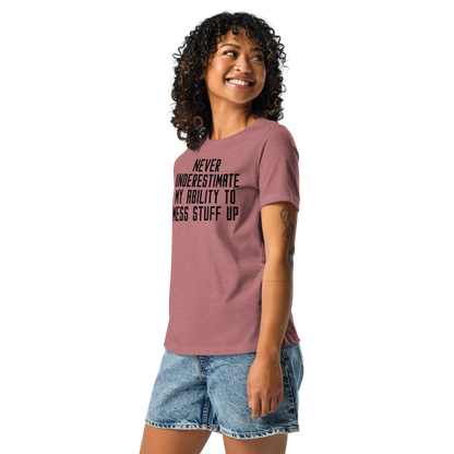 "Never Understimate My Ability To Mess Stuff Up" printed on a heather mauve women's relaxed t-shirt worn by a female