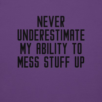"Never Understimate My Ability To Mess Stuff Up" printed on a purple background