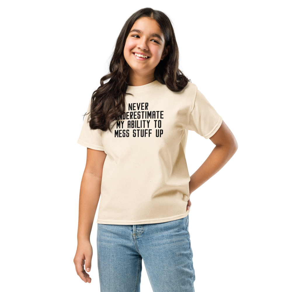 "Never Understimate My Ability To Mess Stuff Up" printed on a natural youth classic tee worn by a female