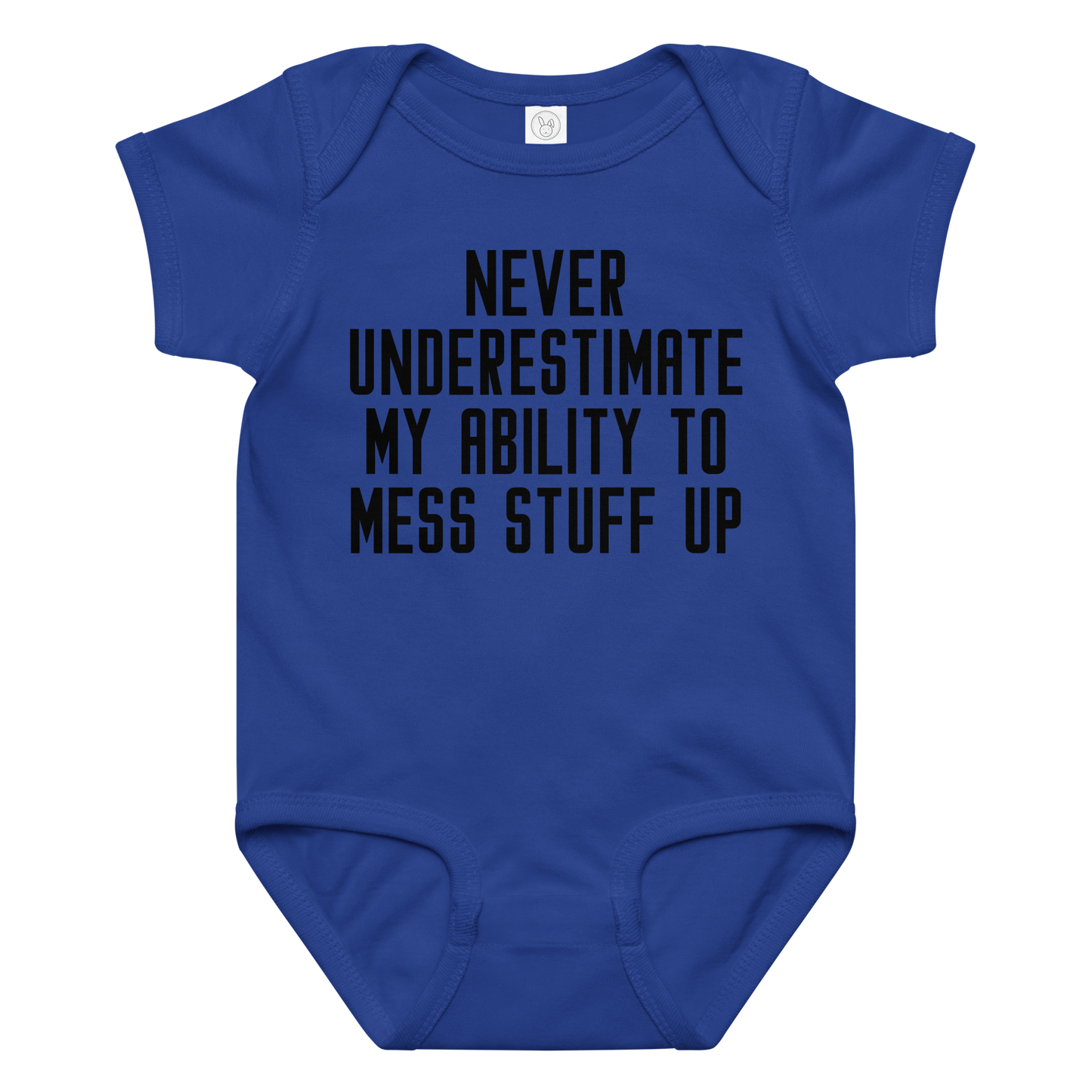 "Never Understimate My Ability To Mess Stuff Up" printed on a royal baby jersey bodysuit laying on a flat surface amongst other clothes