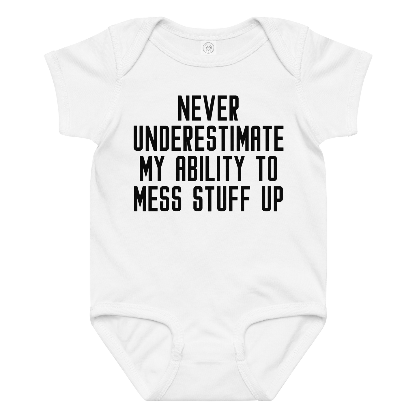 "Never Understimate My Ability To Mess Stuff Up" printed on a white baby jersey bodysuit laying on a flat surface amongst other clothes