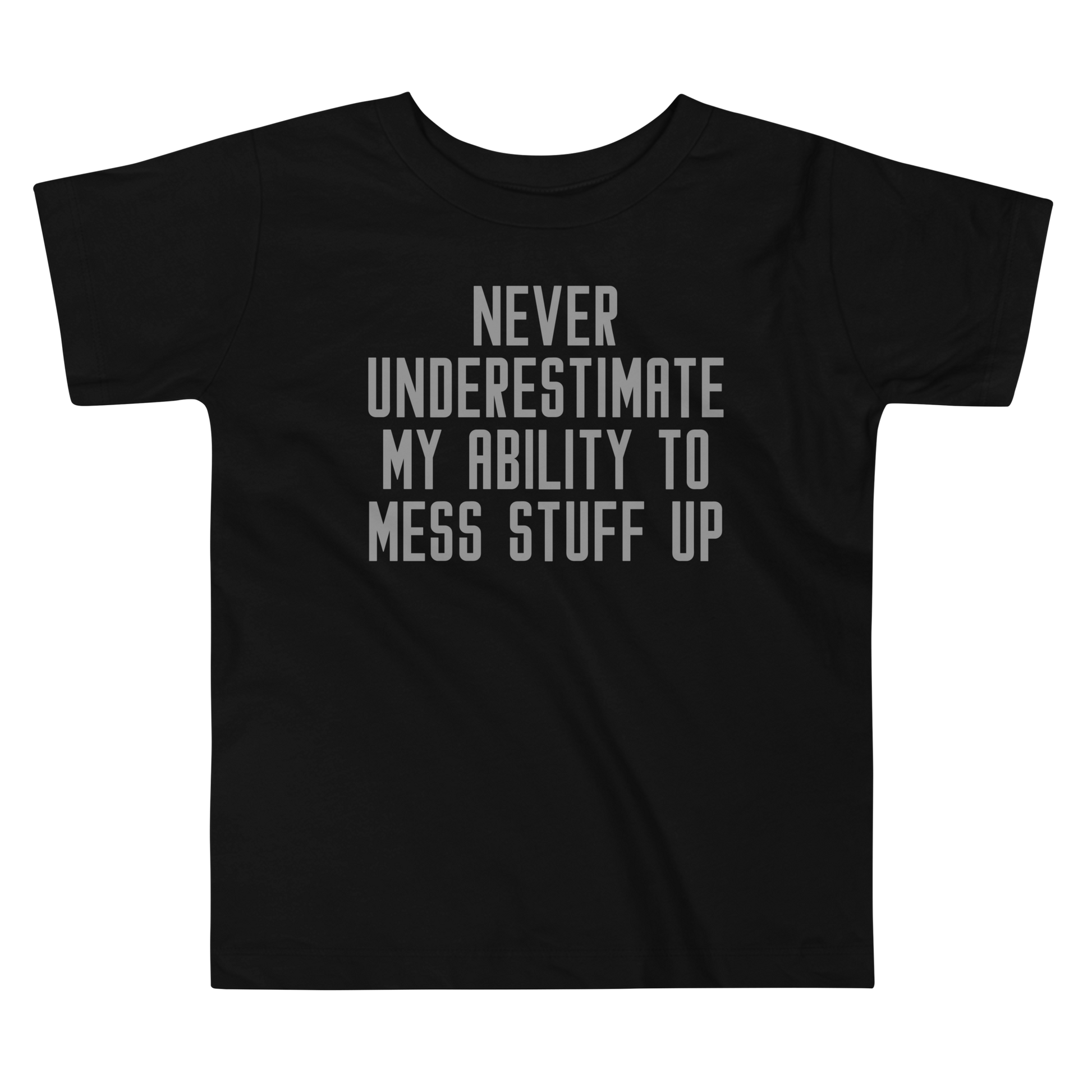 "Never Understimate My Ability To Mess Stuff Up" printed on a black toddler short sleeve tee laying on a flat surface