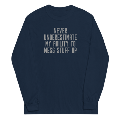 "Never Understimate My Ability To Mess Stuff Up" printed on a navy men's long sleeve shirt laying on a flat surface