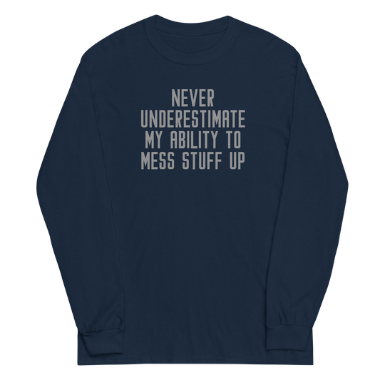 "Never Understimate My Ability To Mess Stuff Up" printed on a navy men's long sleeve shirt laying on a flat surface