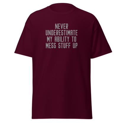"Never Understimate My Ability To Mess Stuff Up" printed on a maroon on an invisible body