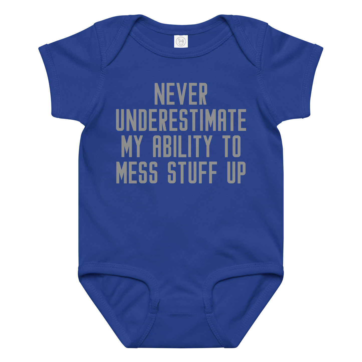 "Never Understimate My Ability To Mess Stuff Up" printed on a royal baby jersey bodysuit laying on a flat surface amongst other clothes