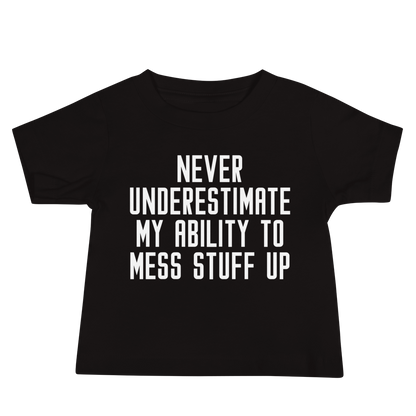 "Never Understimate My Ability To Mess Stuff Up" printed on a black baby jersey short sleeve tee laying on a flat surface
