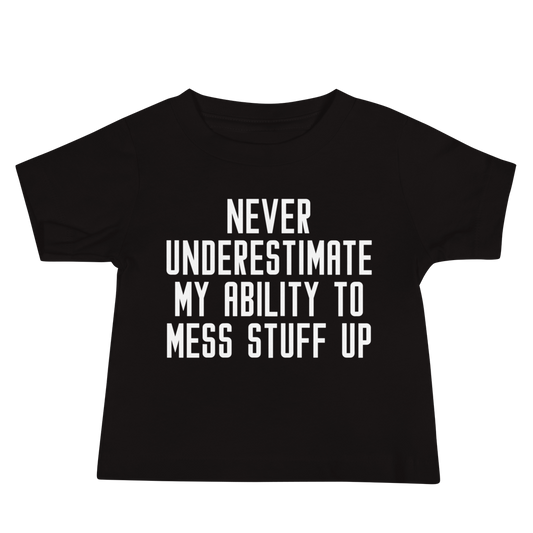 "Never Understimate My Ability To Mess Stuff Up" printed on a black baby jersey short sleeve tee laying on a flat surface