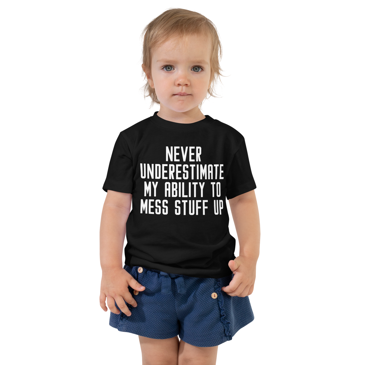 "Never Understimate My Ability To Mess Stuff Up" printed on a black toddler short sleeve tee worn by a female