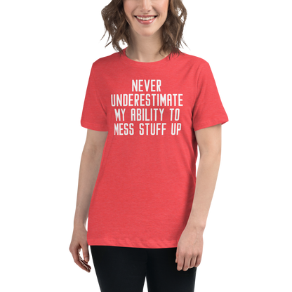 "Never Understimate My Ability To Mess Stuff Up" printed on a heather red women's relaxed t-shirt worn by a female
