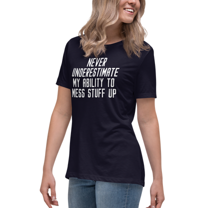 "Never Understimate My Ability To Mess Stuff Up" printed on a navy women's relaxed t-shirt worn by a female