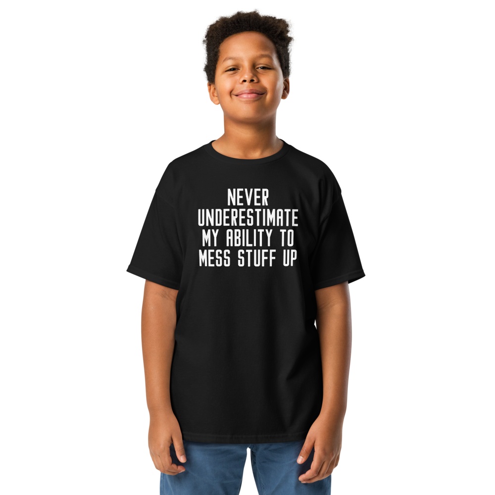 "Never Understimate My Ability To Mess Stuff Up" printed on a black youth classic tee worn by a male