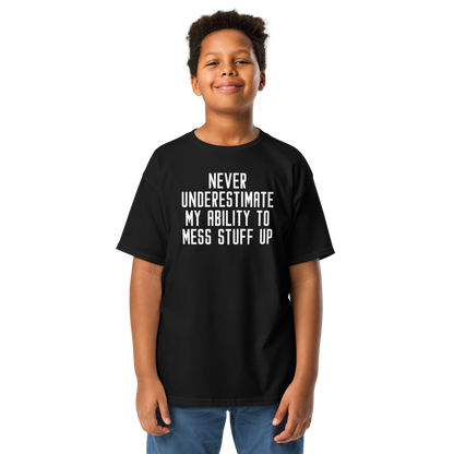 "Never Understimate My Ability To Mess Stuff Up" printed on a black youth classic tee worn by a male