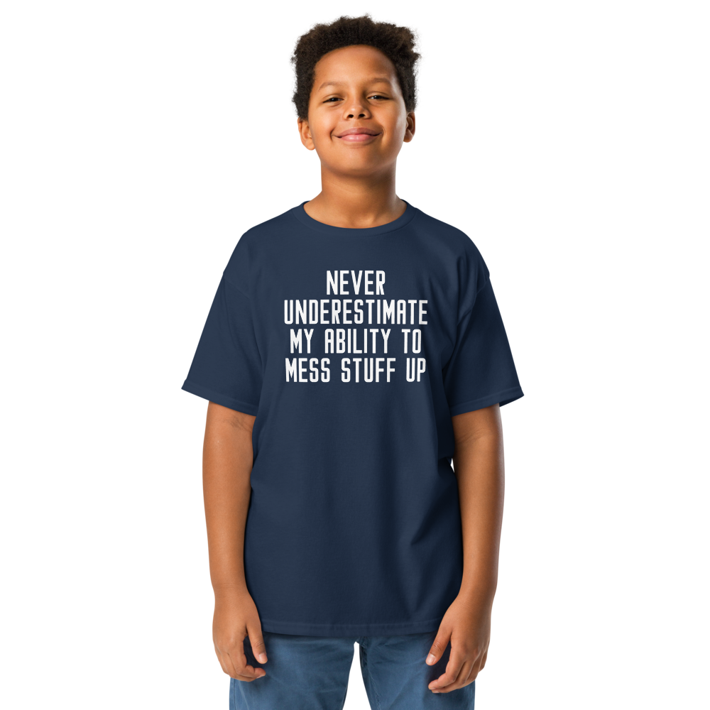 "Never Understimate My Ability To Mess Stuff Up" printed on a navy youth classic tee worn by a male