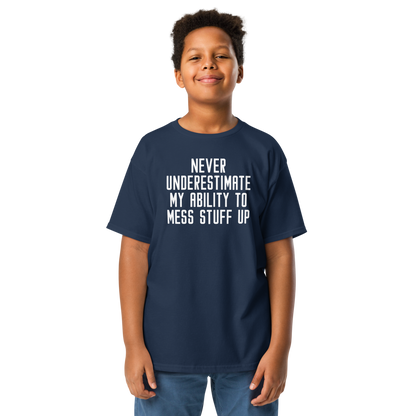 "Never Understimate My Ability To Mess Stuff Up" printed on a navy youth classic tee worn by a male