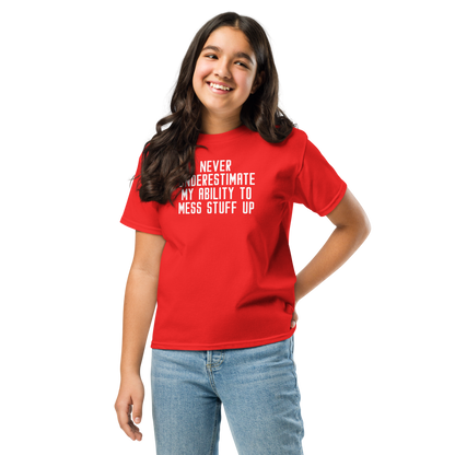 "Never Understimate My Ability To Mess Stuff Up" printed on a red youth classic tee worn by a female