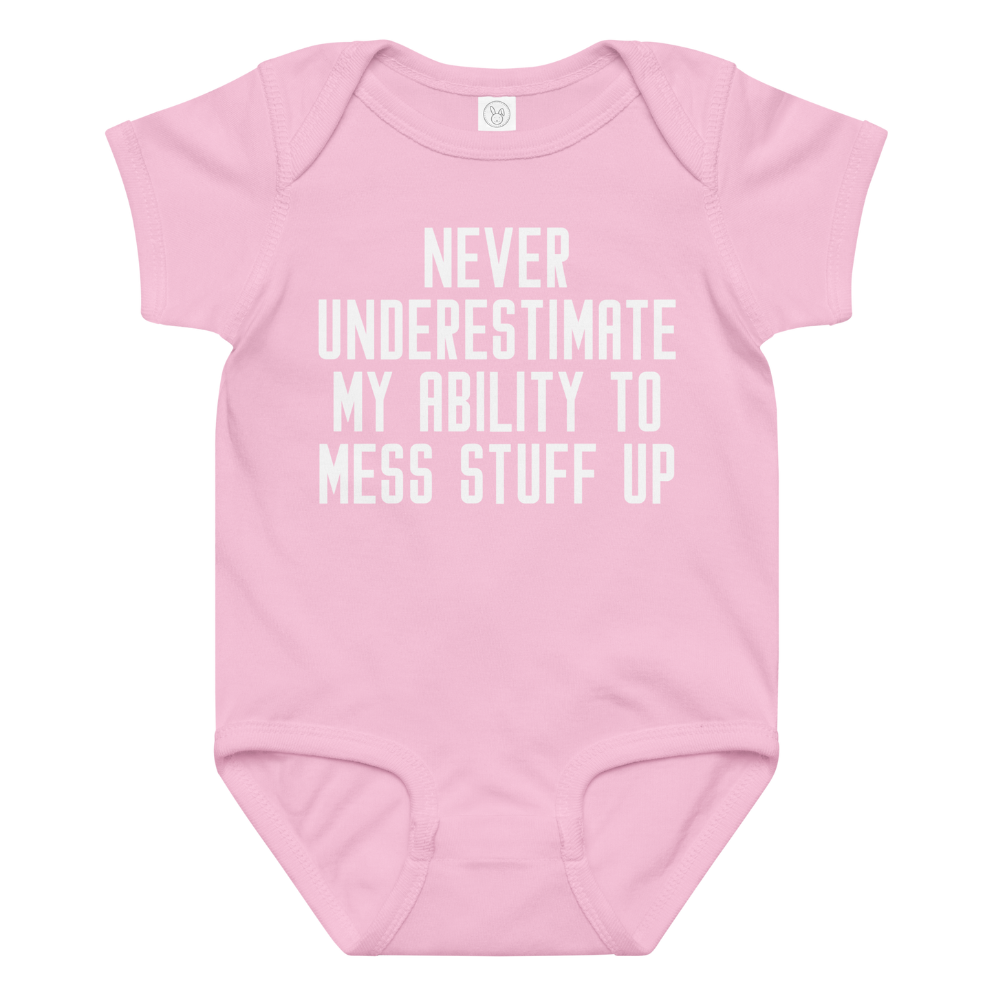 "Never Understimate My Ability To Mess Stuff Up" printed on a pink baby jersey bodysuit laying on a flat surface amongst other clothes