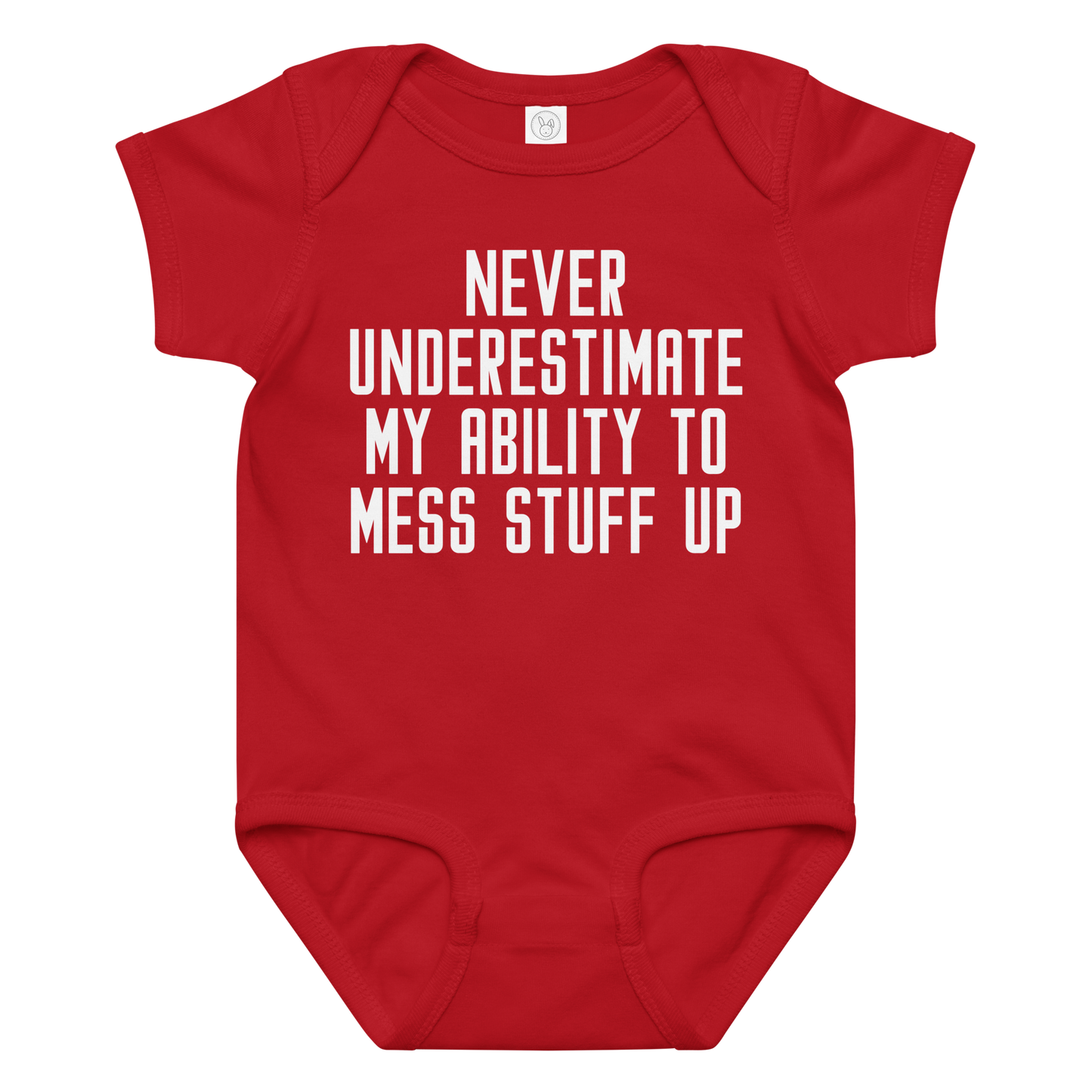 "Never Understimate My Ability To Mess Stuff Up" printed on a red baby jersey bodysuit laying on a flat surface amongst other clothes