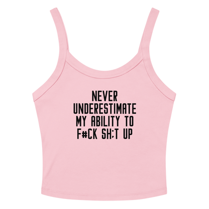 "Never Understimate My Ability To F#Ck Sh:t Up" printed on a solid pink blend women's micro-rib tanktop laying on a flat surface amongst sunglasses and shorts