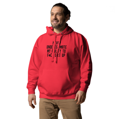 "Never Understimate My Ability To F#Ck Sh:t Up" printed on a team red unisex hoodie worn by a male