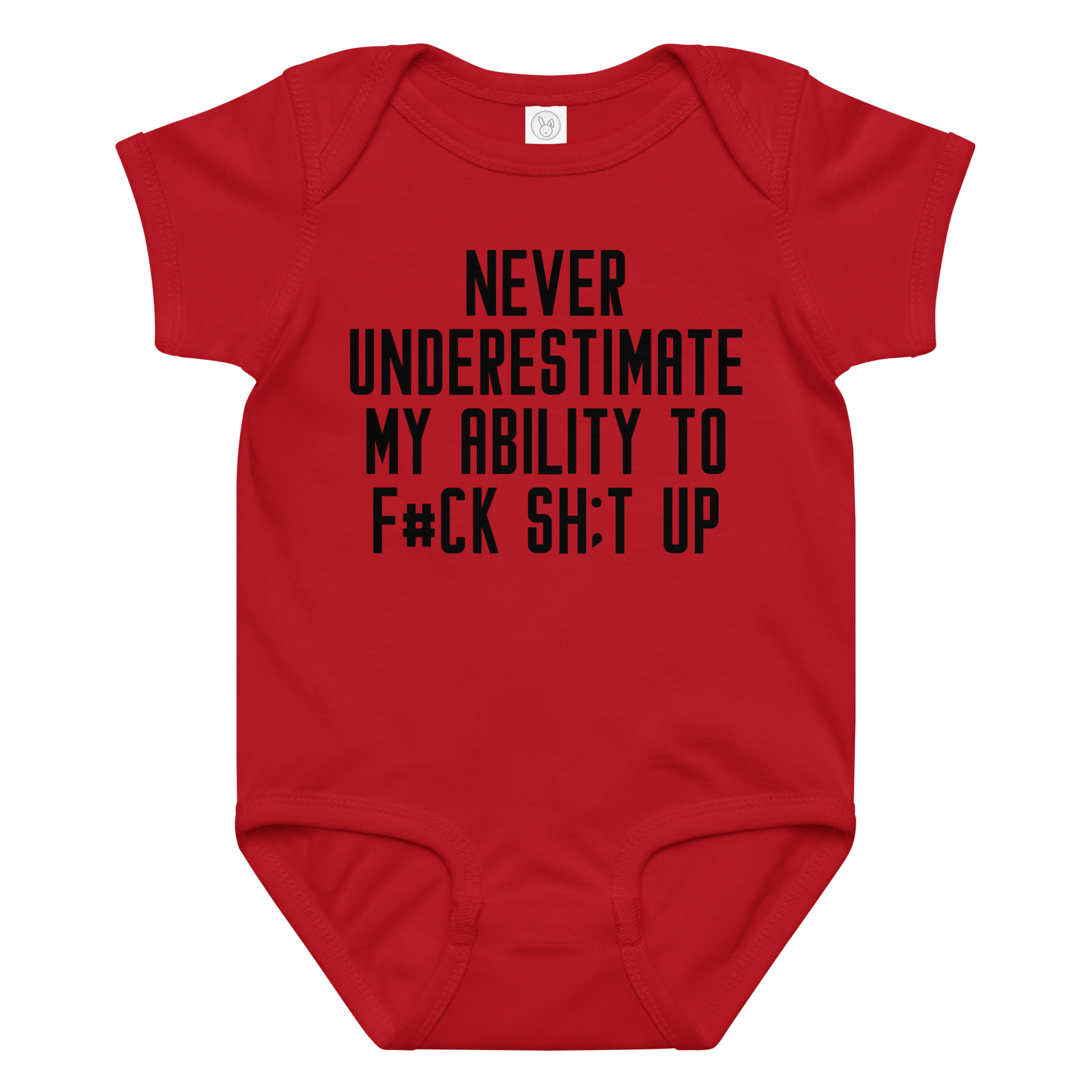 "Never Understimate My Ability To F#Ck Sh:t Up" printed on a red baby jersey bodysuit laying on a flat surface amongst other clothes