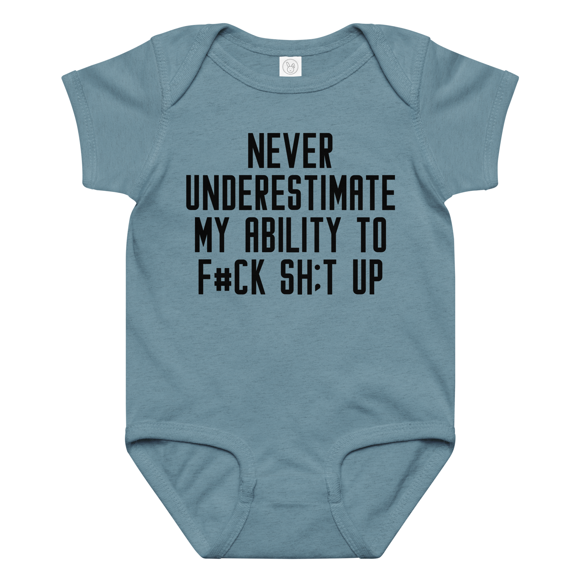 "Never Understimate My Ability To F#Ck Sh:t Up" printed on a vintage indigo baby jersey bodysuit laying on a flat surface amongst other clothes