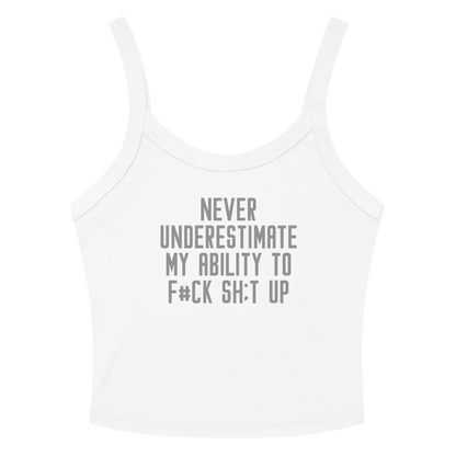 "Never Understimate My Ability To F#Ck Sh:t Up" printed on a solid white blend women's micro-rib tanktop laying on a flat surface amongst sunglasses and shorts