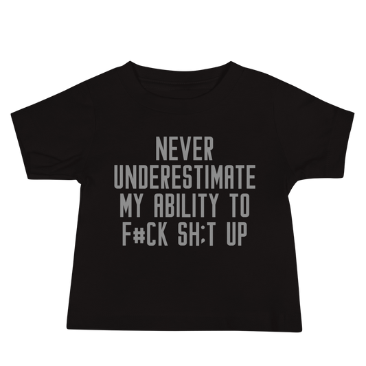 "Never Understimate My Ability To F#Ck Sh:t Up" printed on a black baby jersey short sleeve tee laying on a flat surface